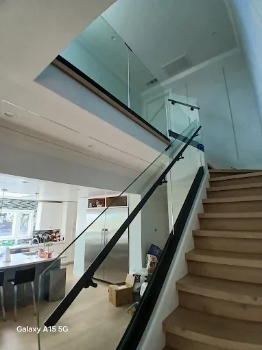 Modern glass stair railing installed in Fremont